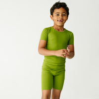 Child wearing an Avocado two piece short sleeve and shorts pajama set