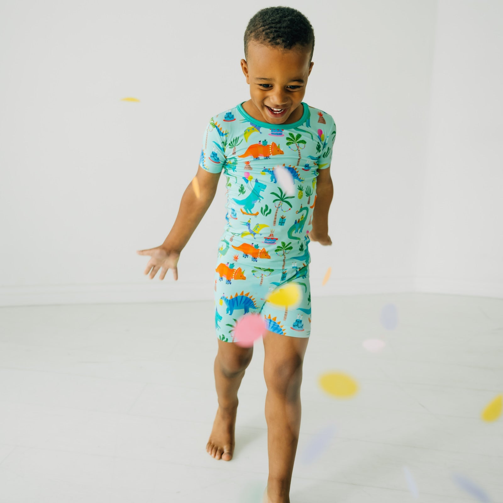 alternate image of a child playing wearing Prehistoric Party two piece short sleeve and shorts pj set