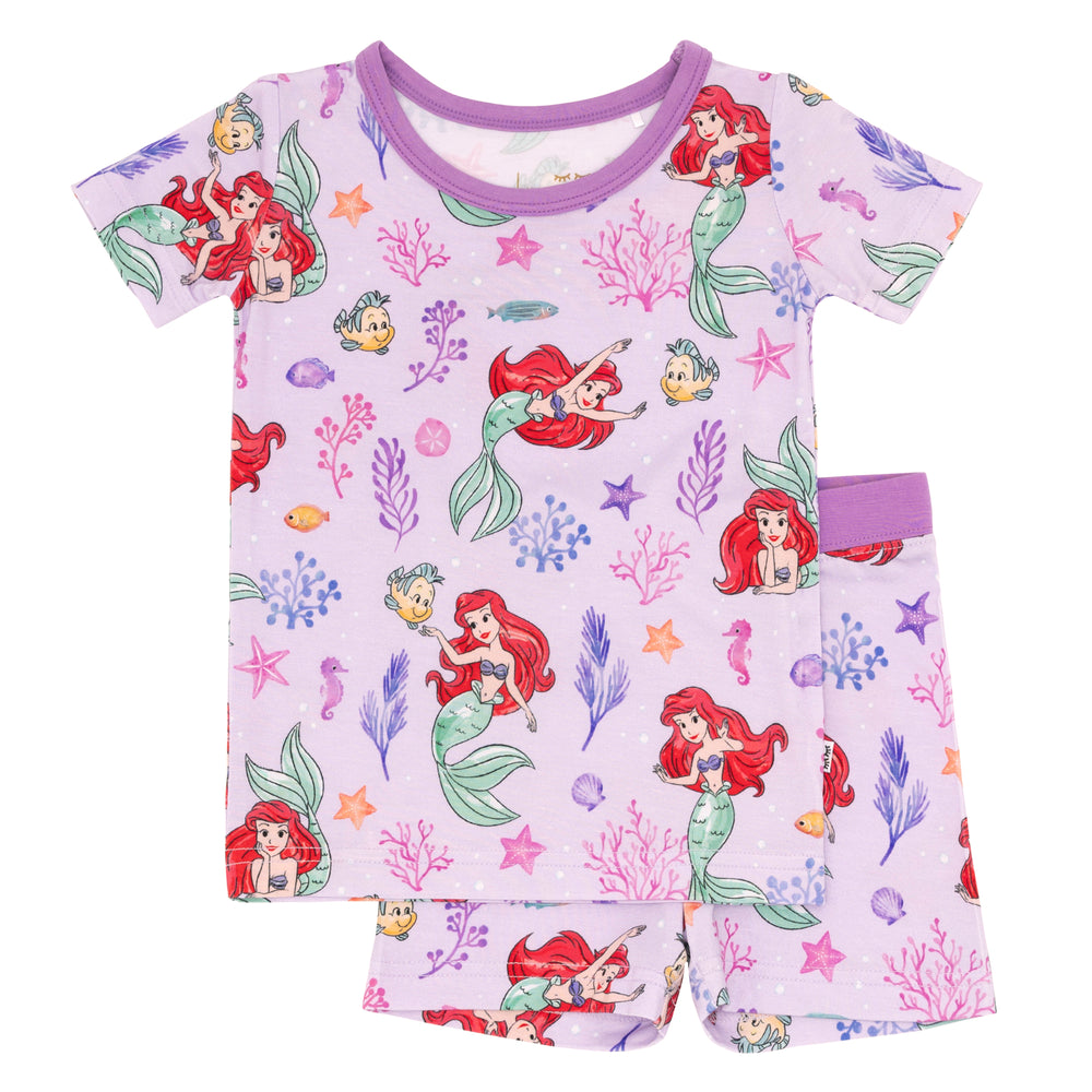 Flat lay image of Disney Part of Her World two piece short sleeve and shorts pajama set