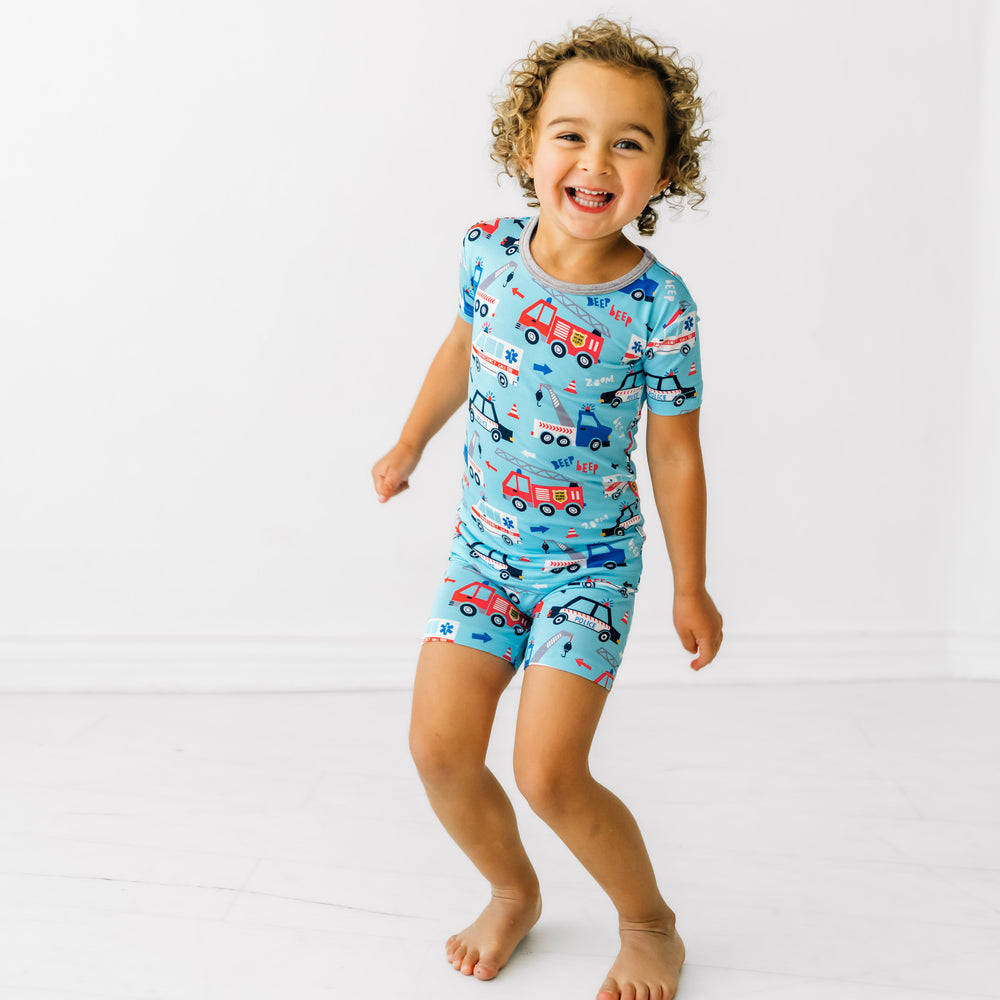 Child wearing a To The Rescue two piece short and short sleeve pj set