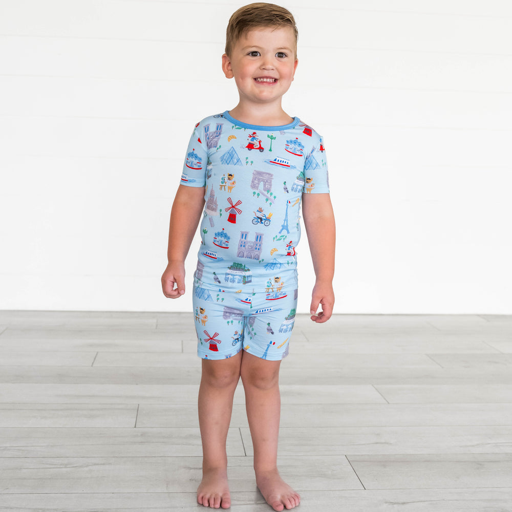Boy wearing the Blue Weekend in Paris Two-Piece Short Sleeve & Shorts Pajama Set