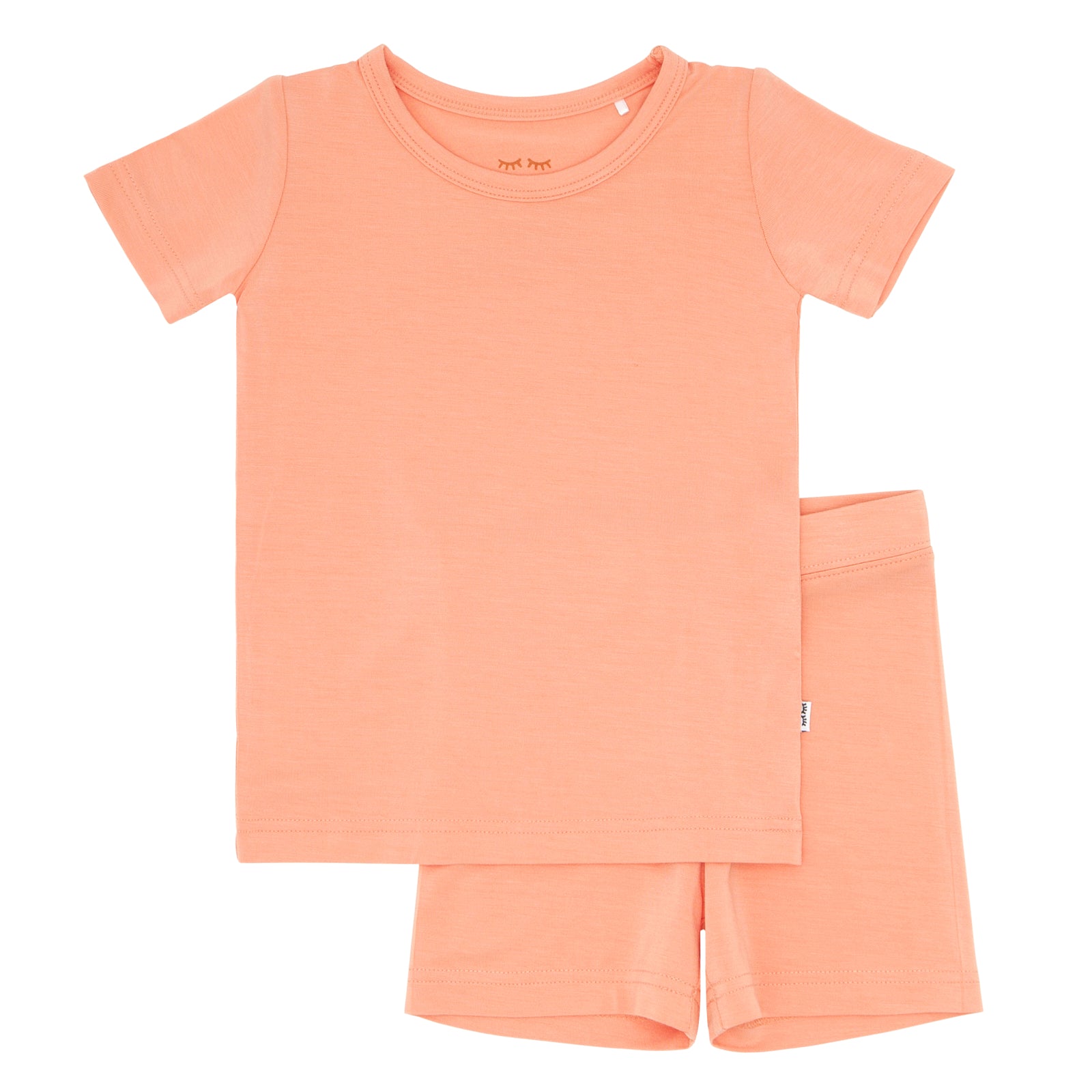 Flat lay image of a Peach short sleeve and shorts pajama set