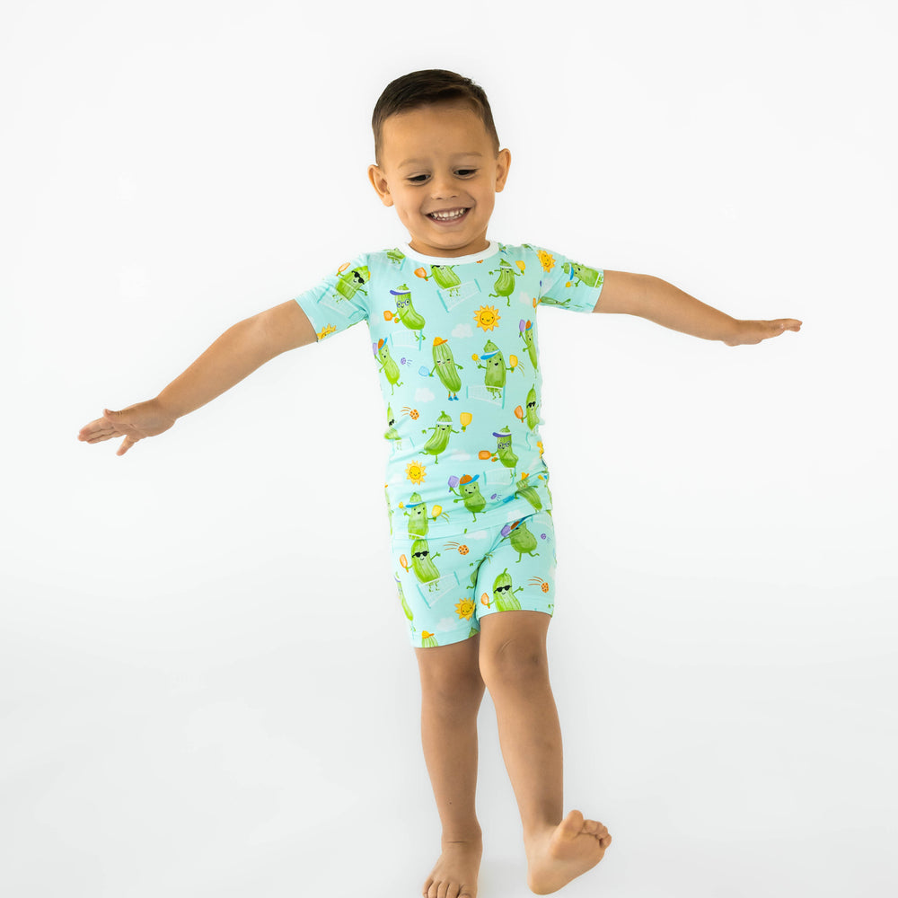 Boy posing while wearing the Pickle Power Two-Piece Short Sleeve & Shorts Pajama Set