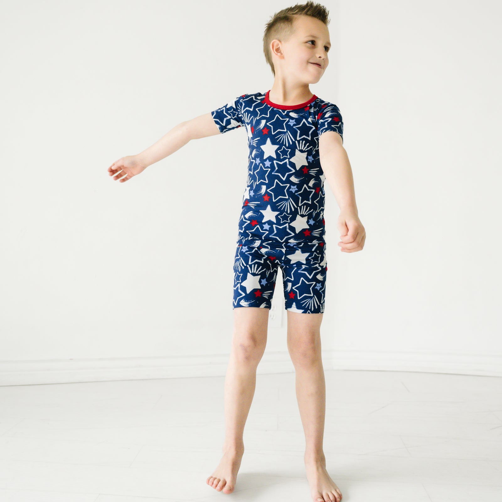 Child wearing a Star Spangled two piece short sleeve and shorts pajama set