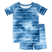 Flat lay image of a Blue Tie Dye Dreams two-piece short sleeve & shorts pajama set