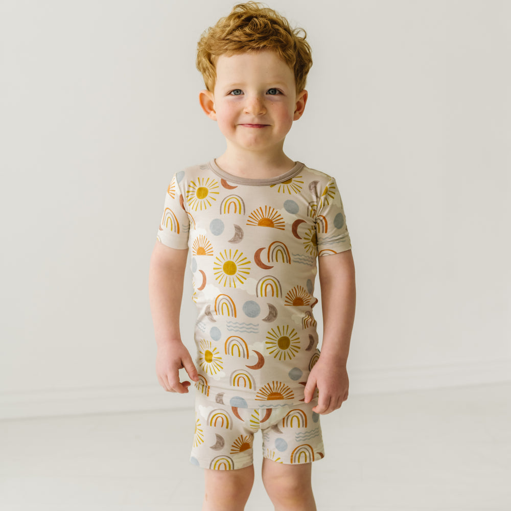 Child wearing a Desert Sunrise two piece short sleeve and shorts pajama set