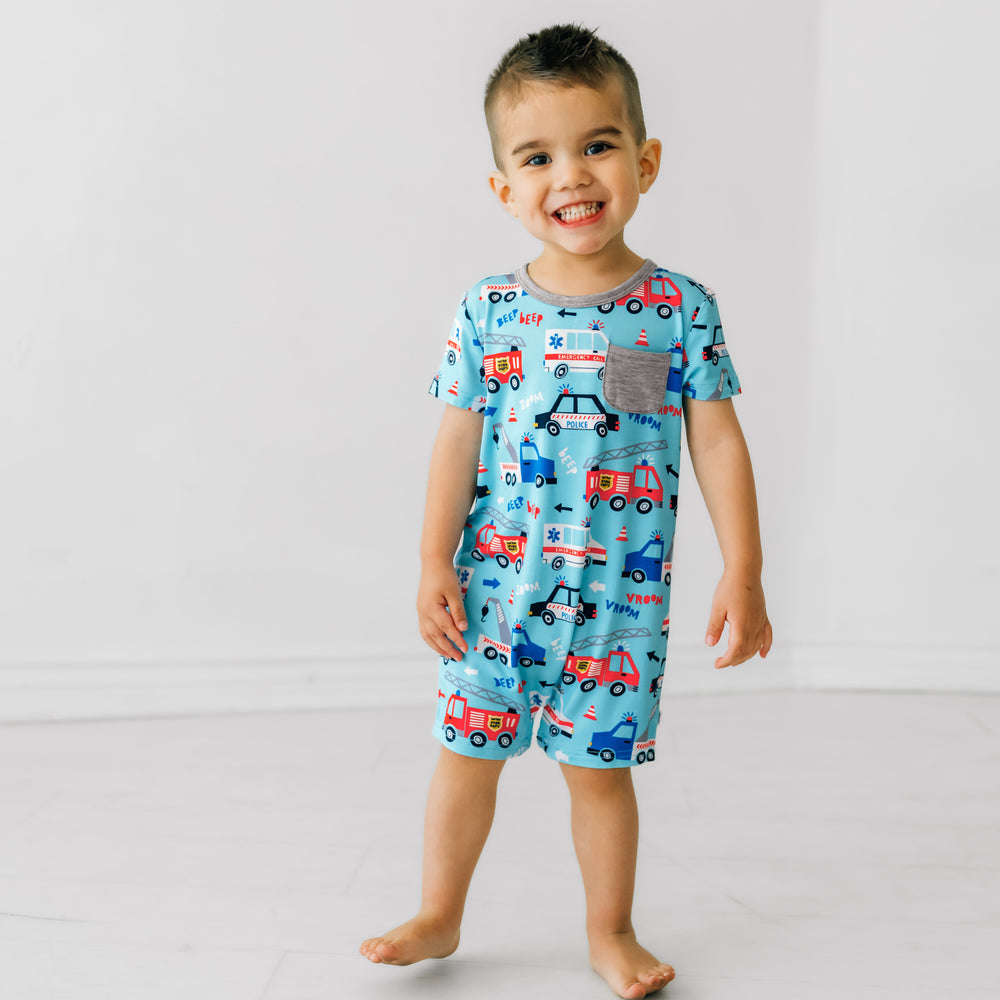Child wearing a To The Rescue Pocket Shorty Romper