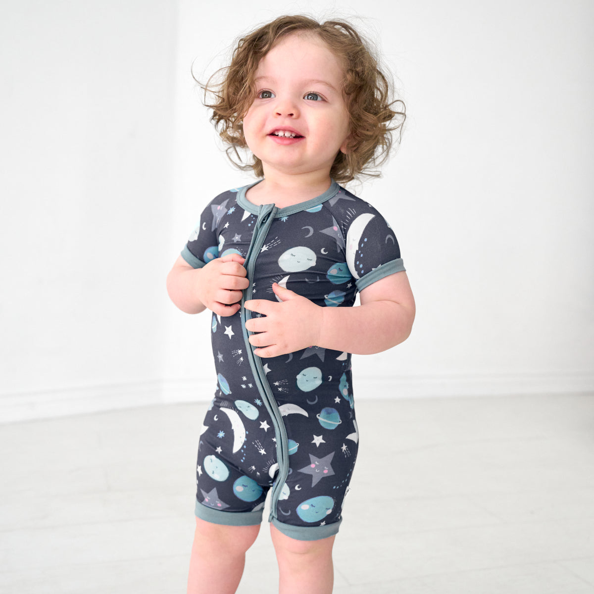 Child wearing a Blue to the Moon and Back zippy