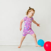 Child playing wearing Magical Birthday shorty zippy