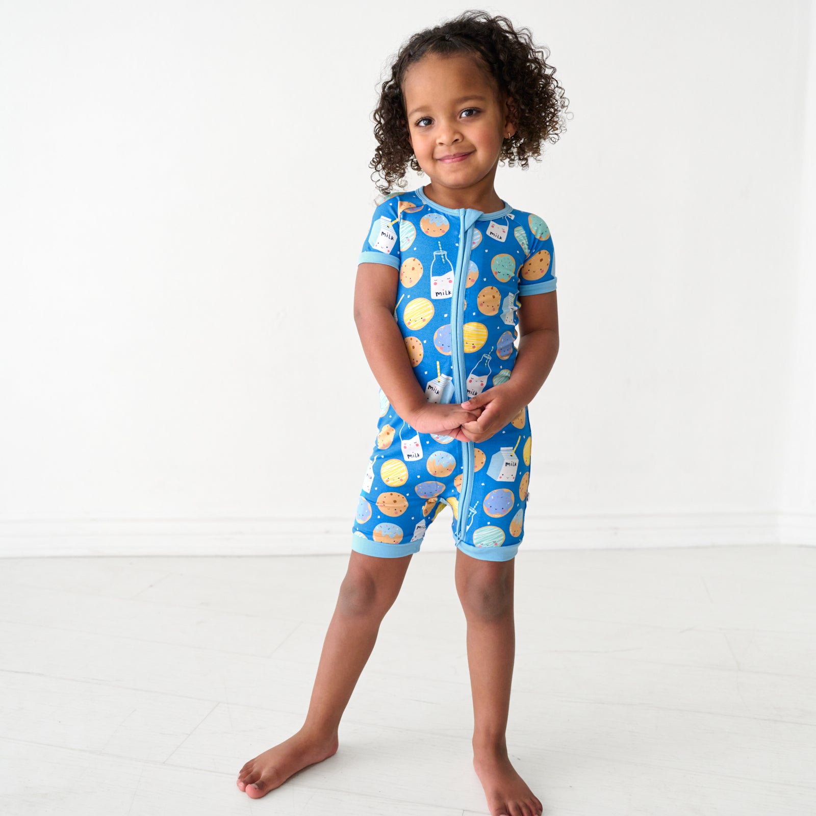 Child wearing a Blue Cookies & Milk Shorty Zippy