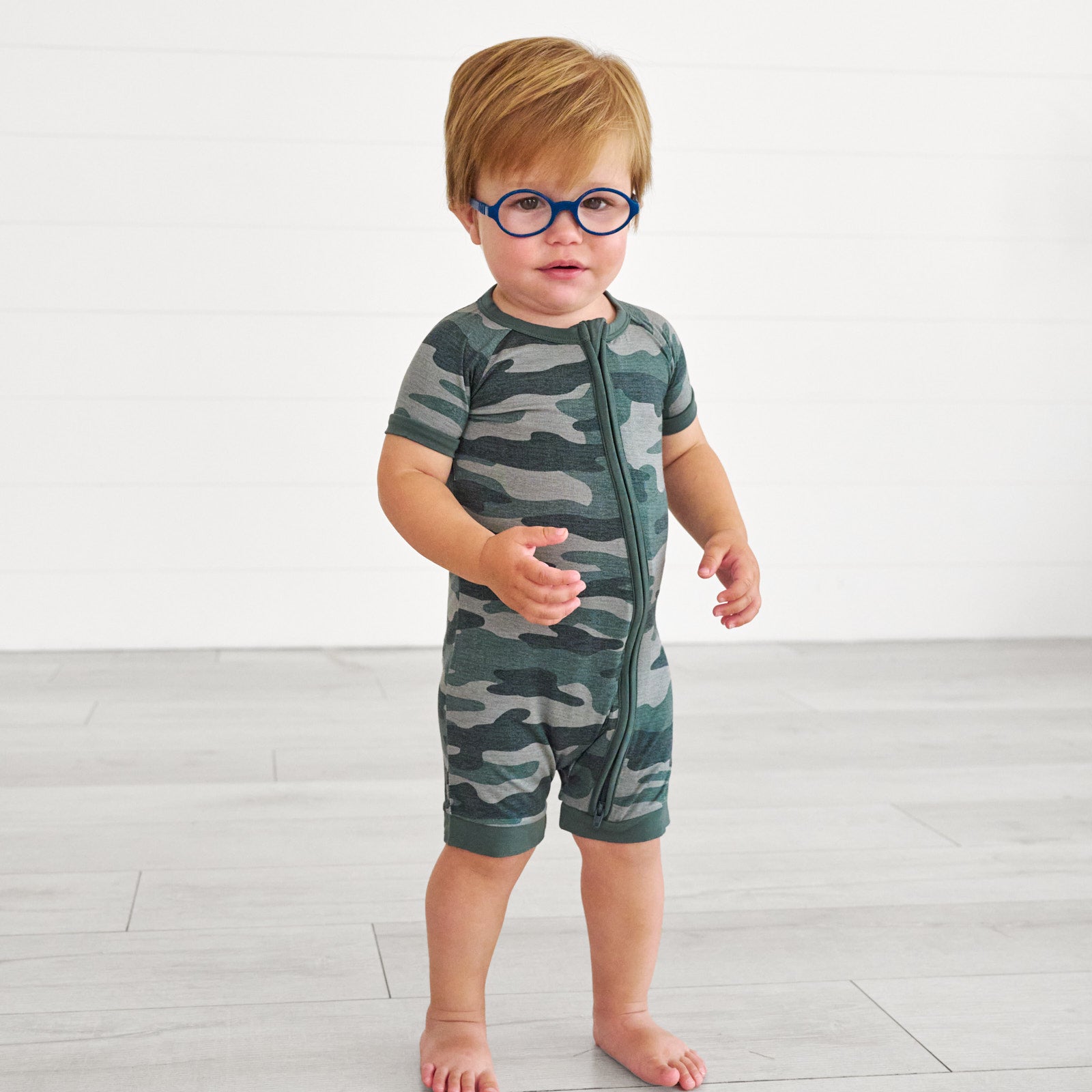 Boy in glasses wearing the Vintage Camo Shorty Zippy