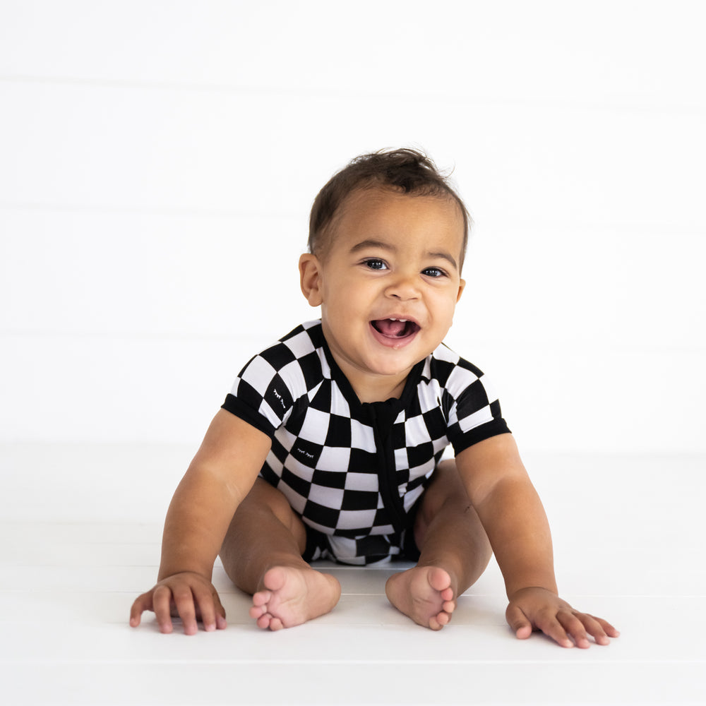 close up image of a child wearing a Cool Checks shorty zippy
