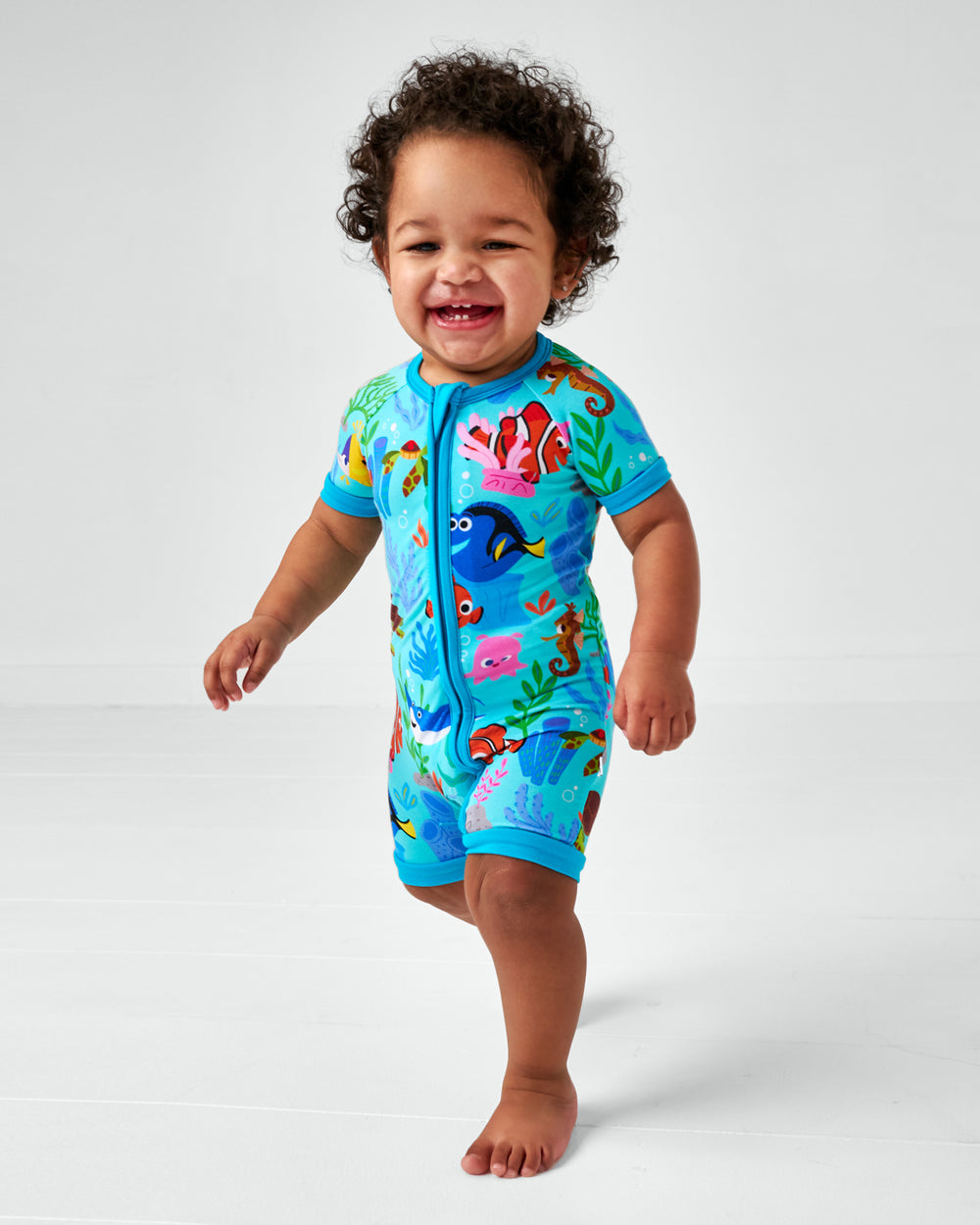 Walking child wearing the Disney Nemo's Reef Shorty Zippy