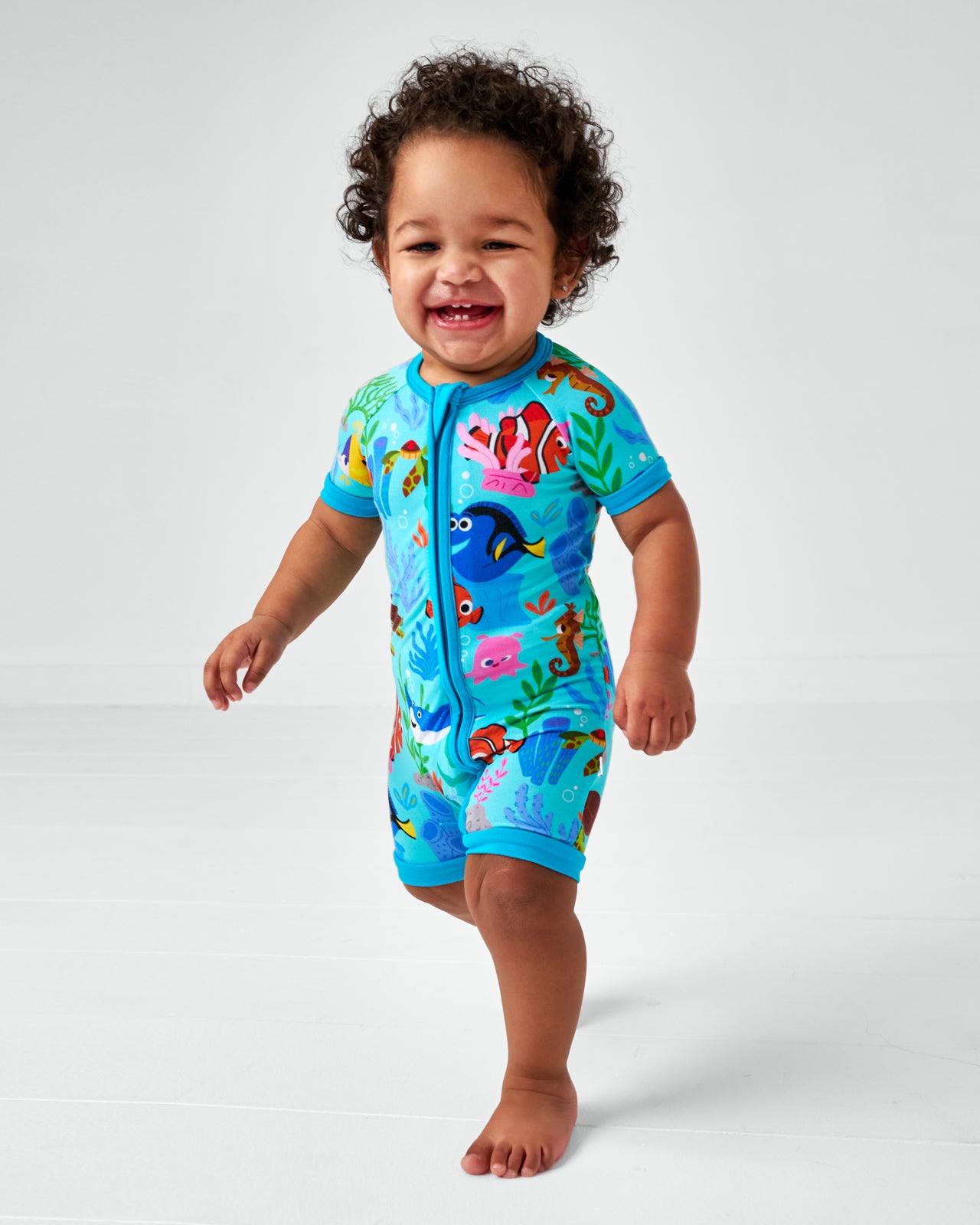 Walking child wearing the Disney Nemo's Reef Shorty Zippy