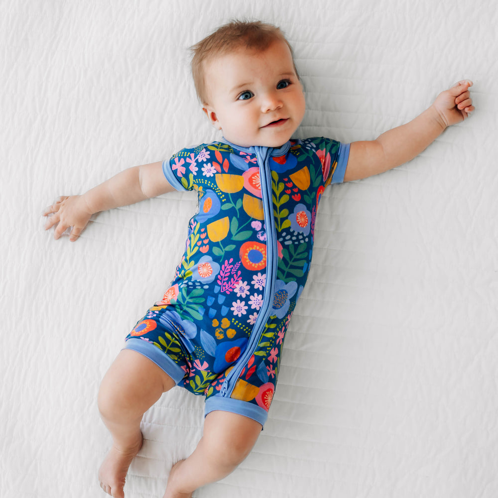 Alternative image of baby laying down wearing the Folk Floral Shorty Zippy