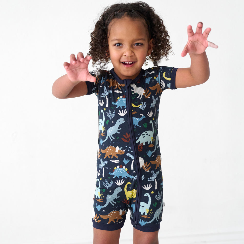 Child posing wearing a Navy Jurassic Jungle Shorty Zippy
