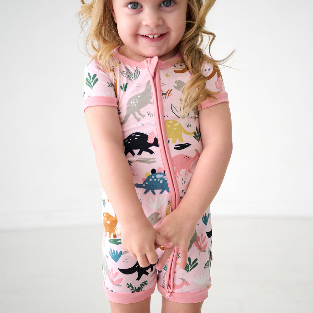 Child wearing a Pink Jurassic Jungle Shorty Zippy
