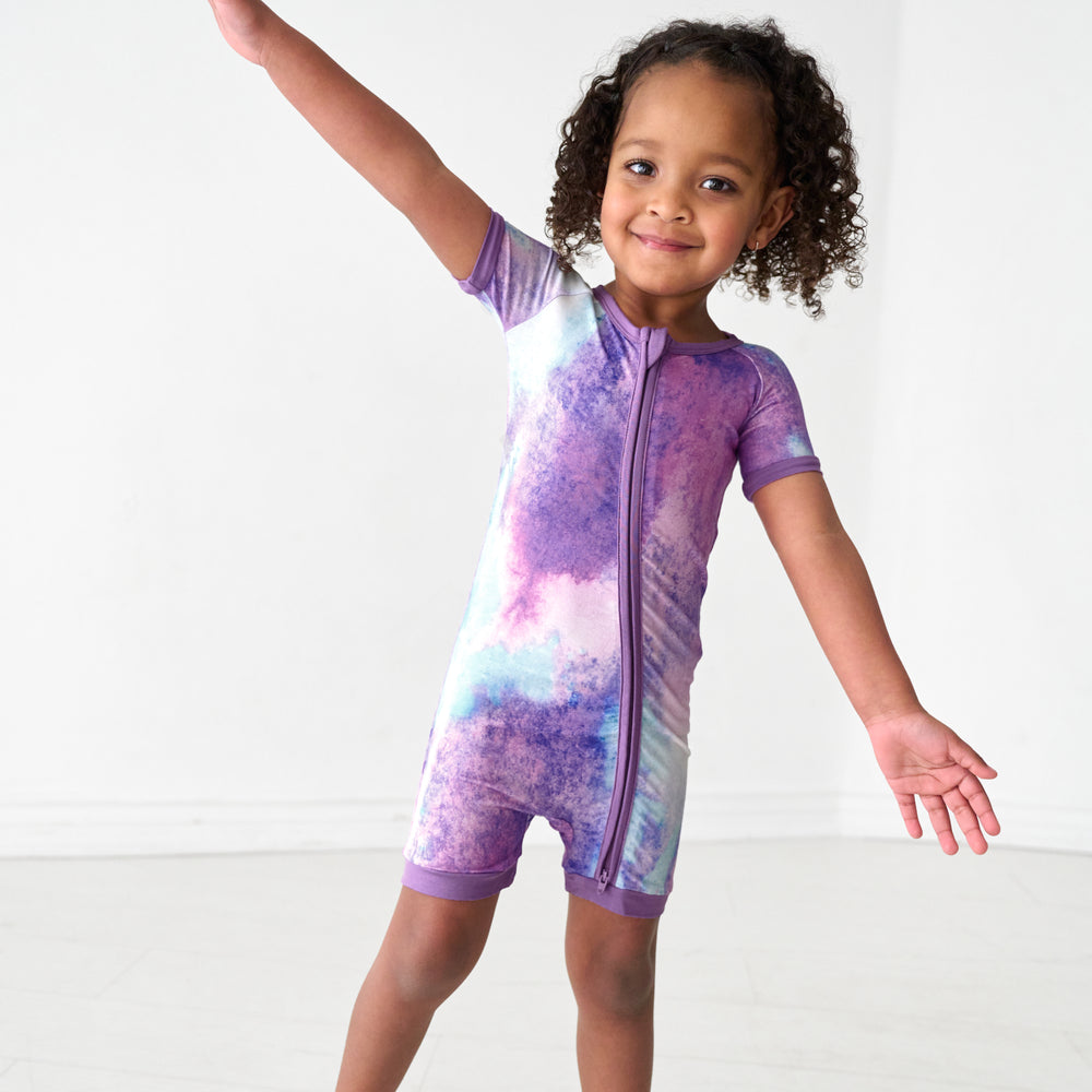 Child wearing a Purple Watercolor shorty zippy