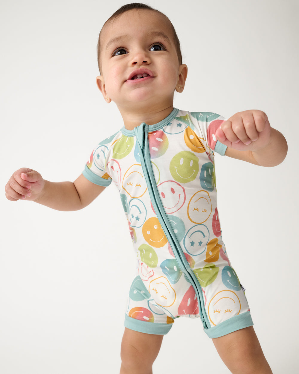 Standing toddler wearing the Positive Vibes Shorty Zippy