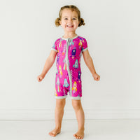 Child wearing a Pink Space Explorer shorty zippy
