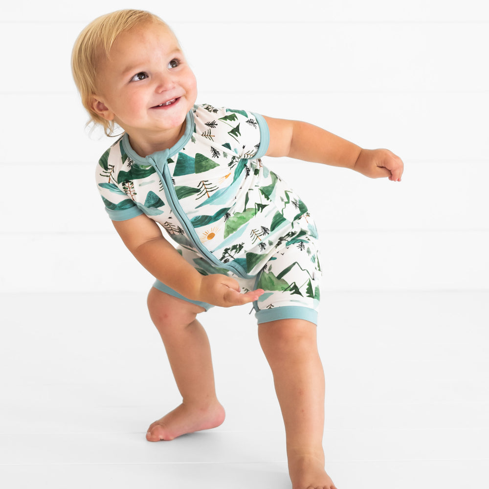 child posing wearing Mountain Mist shorty zippy