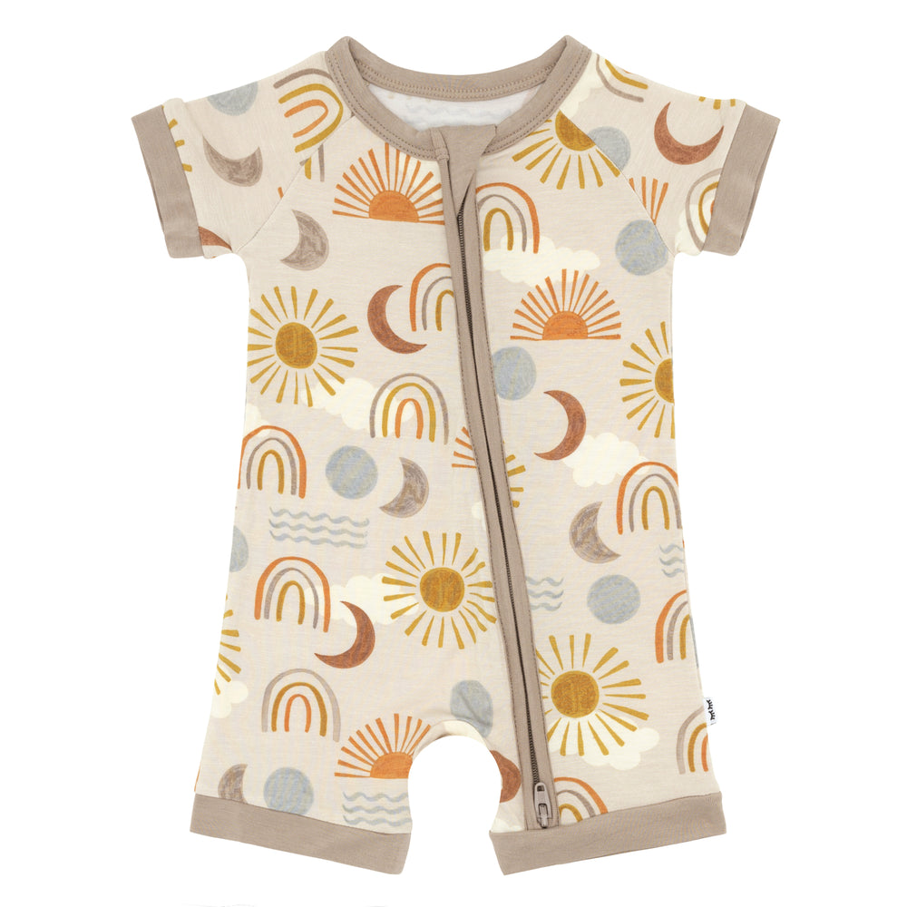 Flat lay image of a child wearing a Desert Sunrise shorty zippy