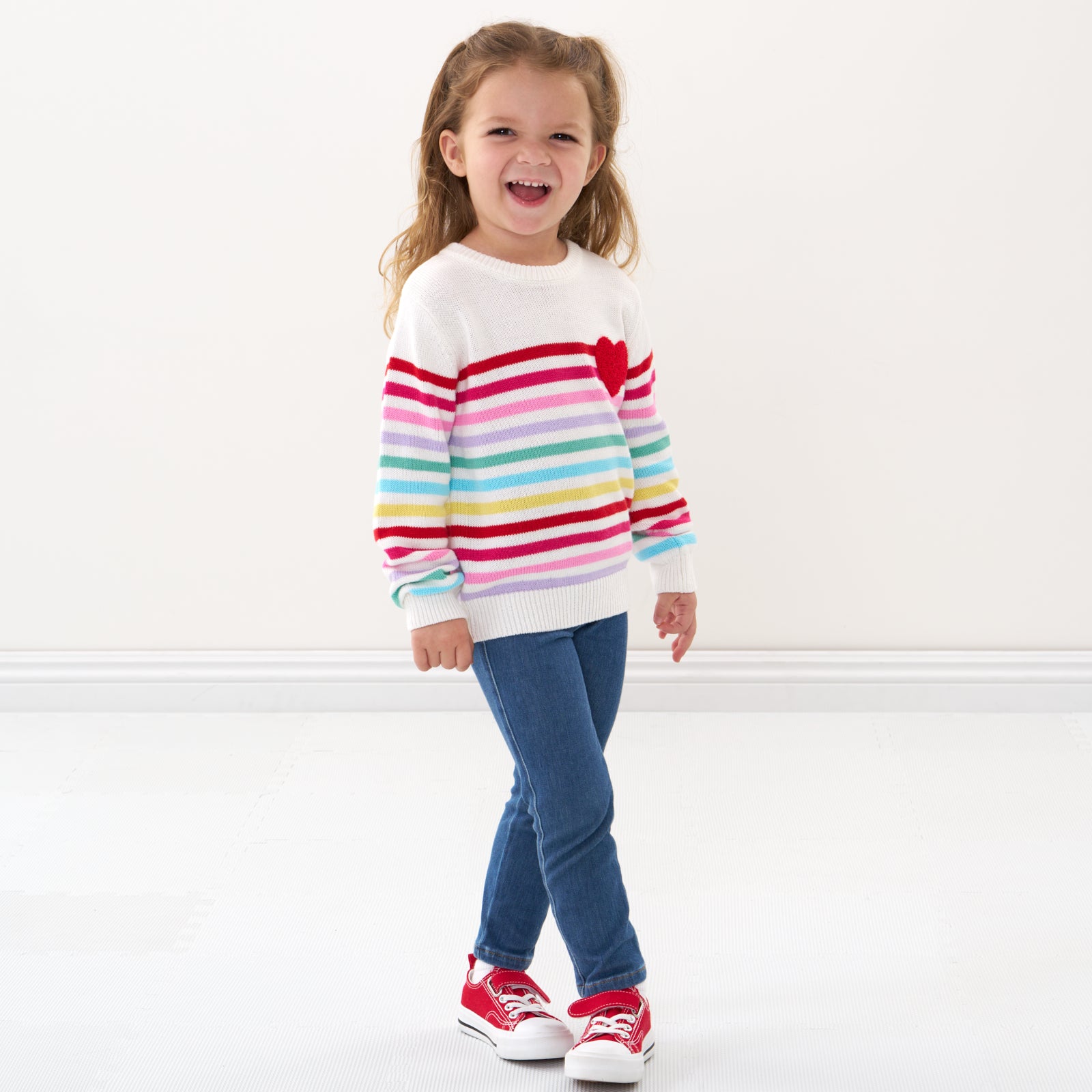 Child wearing a Multi Stripes knit sweater and coordinating pants