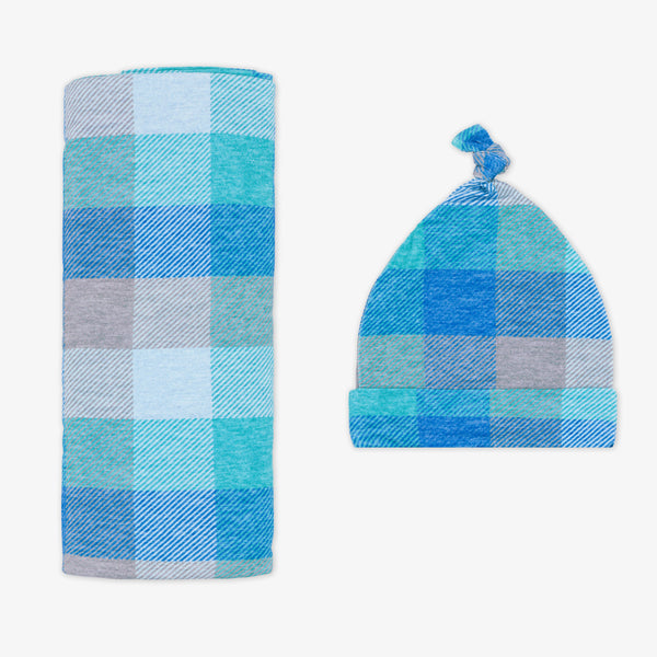 Flat lay image of an Arctic Plaid swaddle and hat set