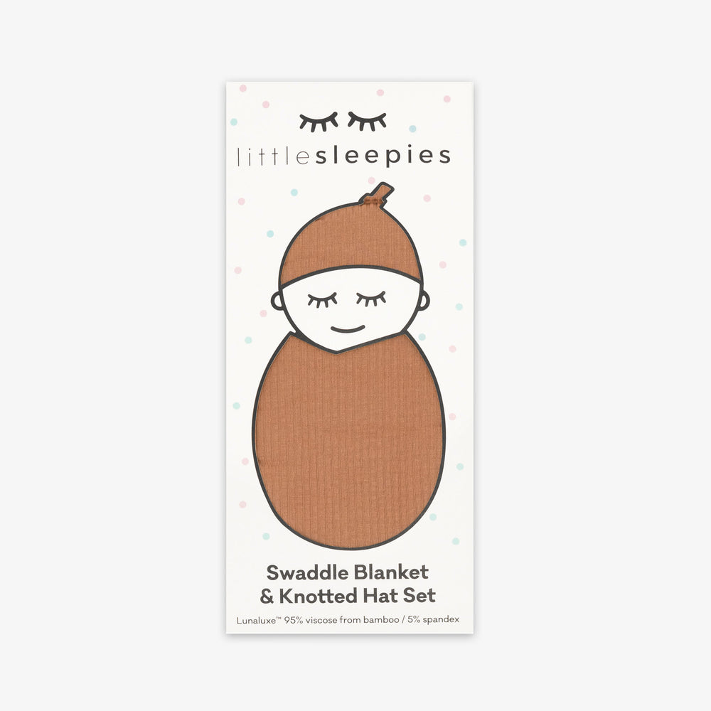 Image of the packaging for a Caramel Ribbed Swaddle & Hat Set