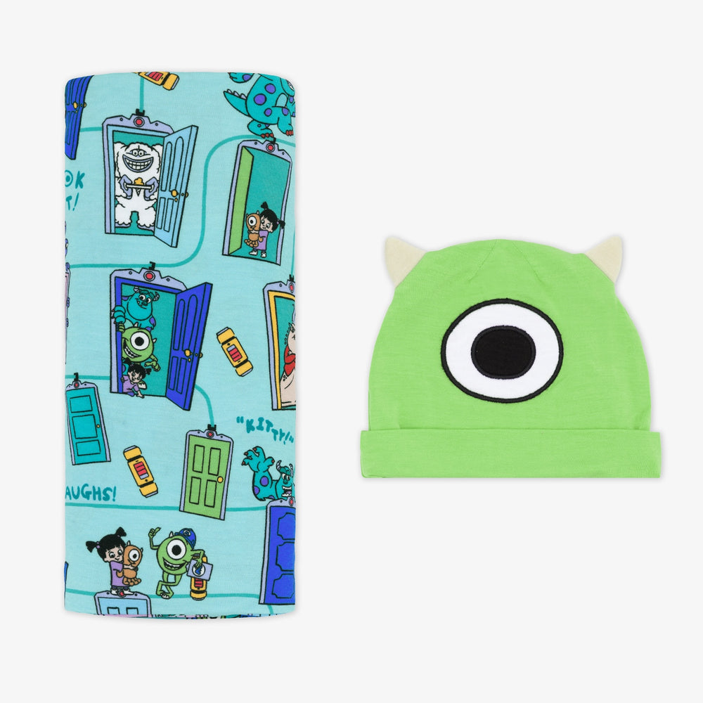 Flat lay image of the Disney Monsters, Inc. Scream Team Swaddle & Hat Set