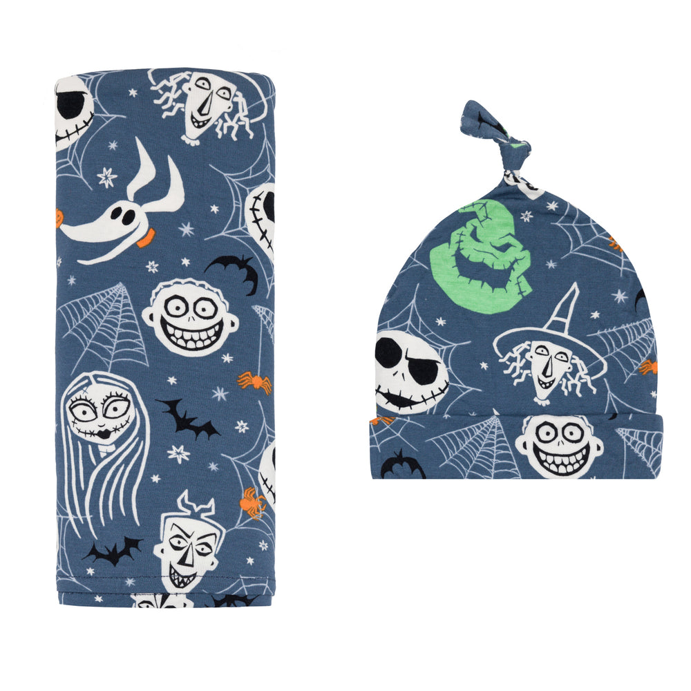 Flat lay image of the Disney Jack & Crew Swaddle & Hat Set