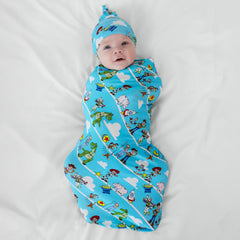 Child laying on a blanket swaddled in a Disney Pixar Toy Story Pals swaddle and hat set