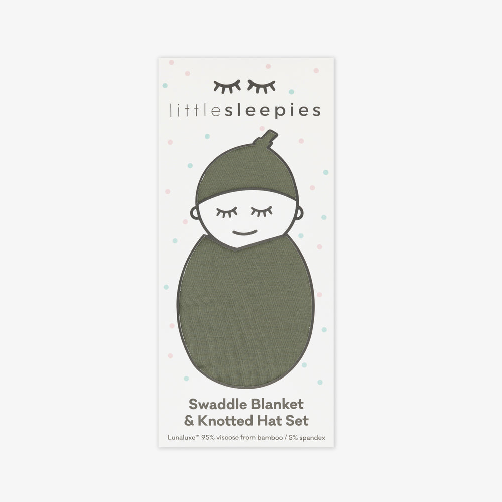 a Cozy Olive swaddle and hat set in Little Sleepies peek a boo packaing