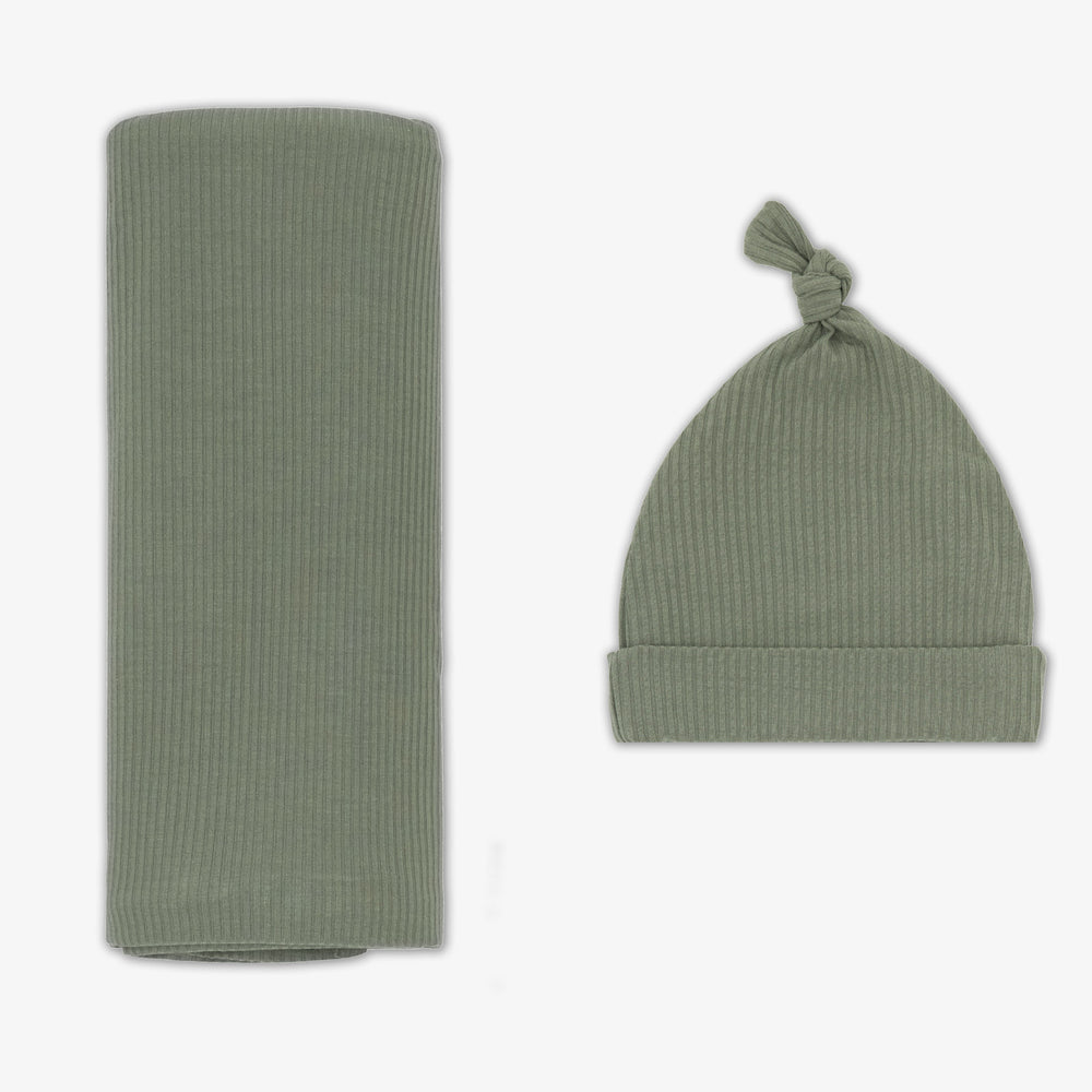 Flat lay image of the Moss Ribbed Swaddle & Hat Set