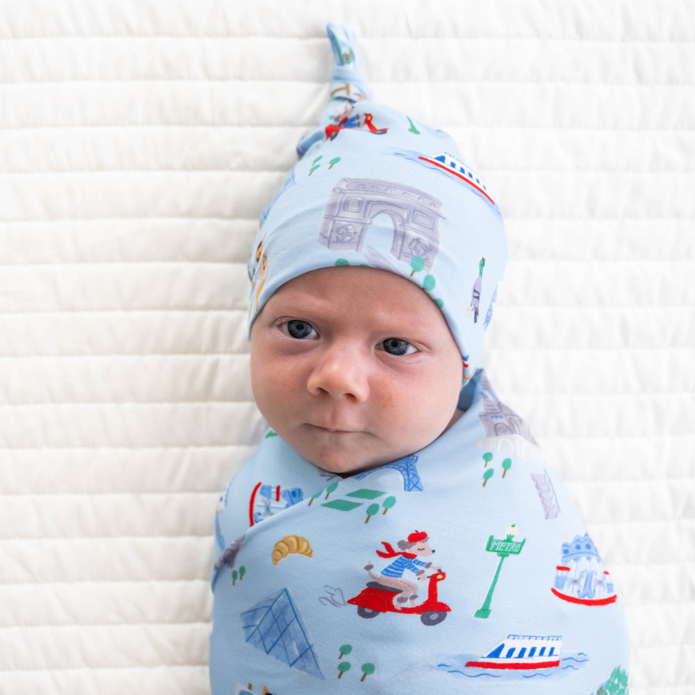 Close up image of the hat in the Blue Weekend in Paris Swaddle & Hat Set