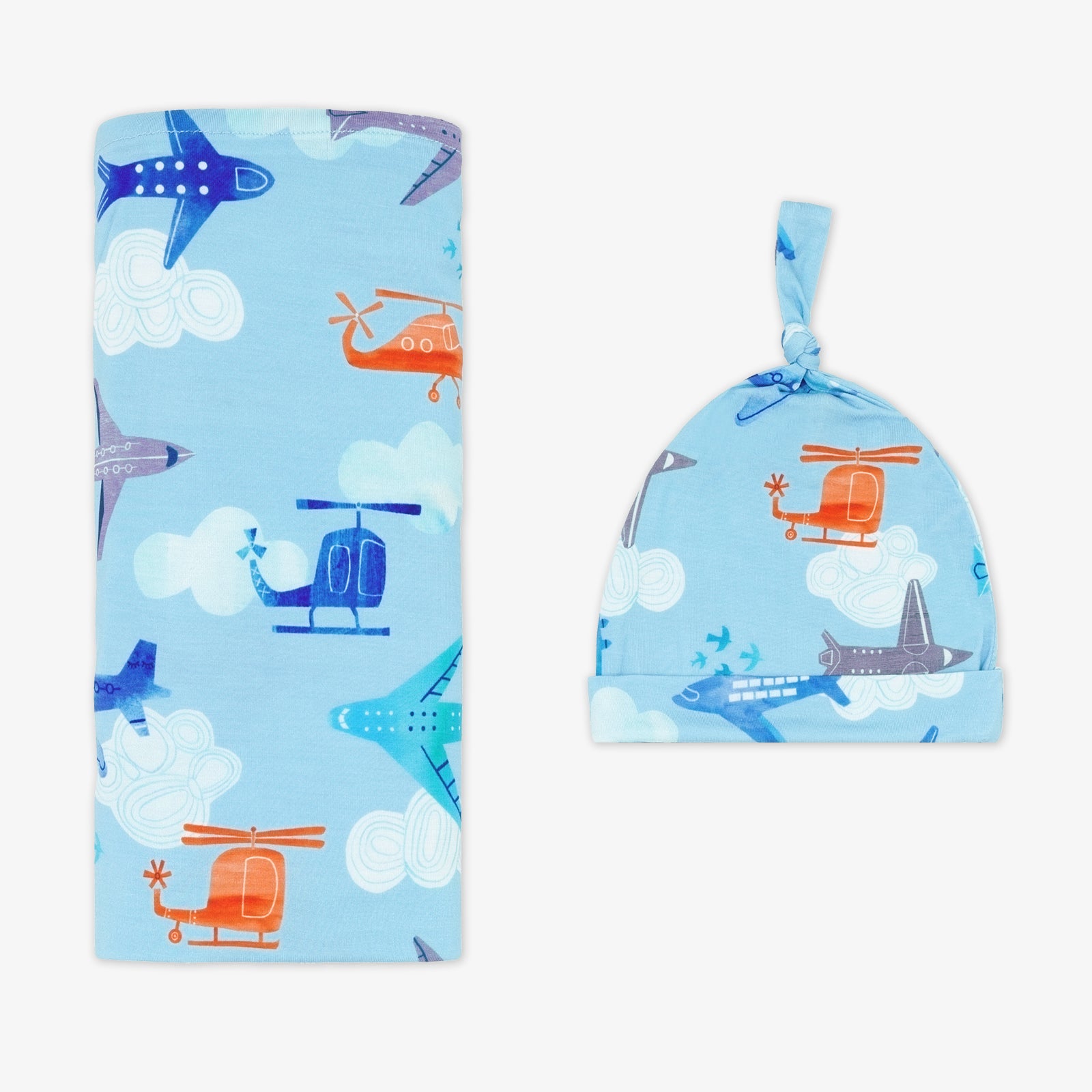 flat lay image of a  Let's Fly swaddle and hat set