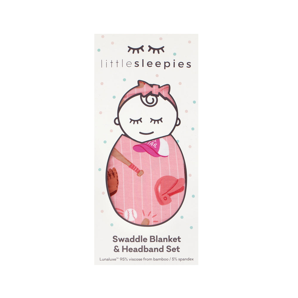 Flat lay image of a Pink All Stars swaddle and luxe bow headband set in Little Sleepies peek a boo packaging 