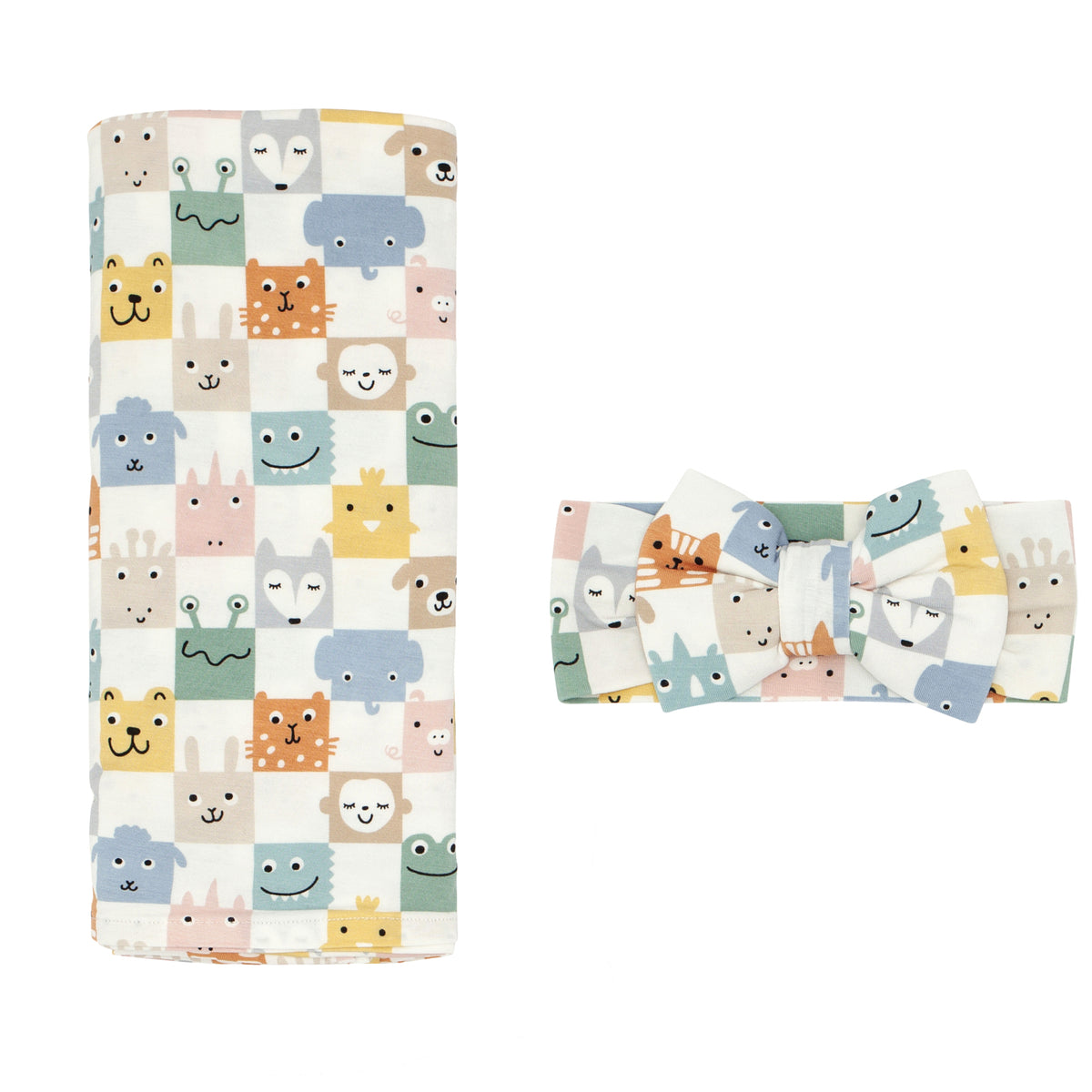 Flat lay image of a Check Mates swaddle and luxe bow headband set