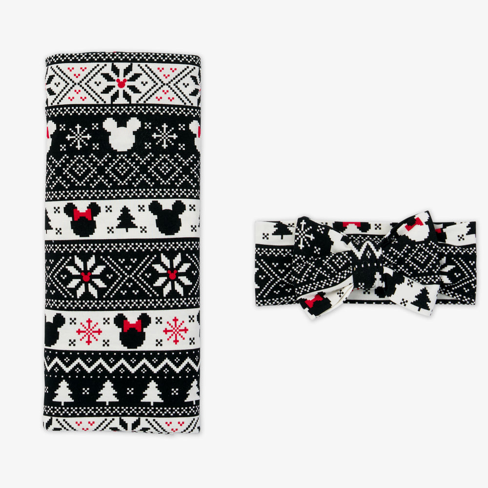 flat lay image of a Mickey Fair Isle swaddle and luxe bow headband set