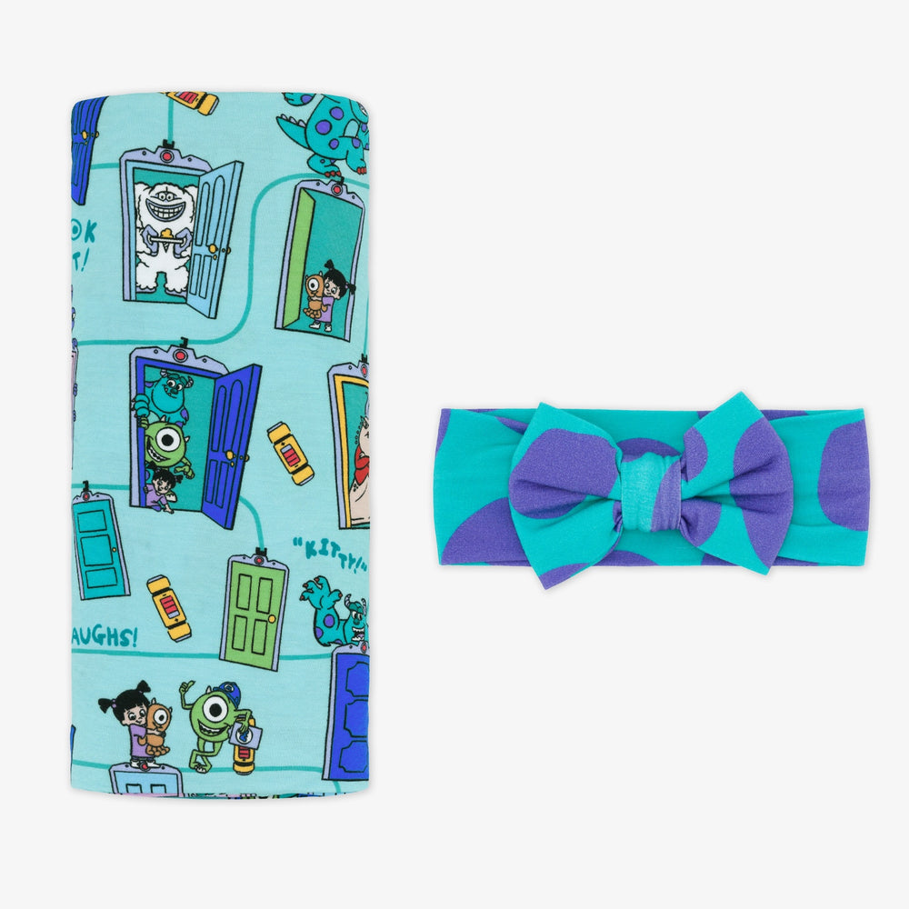 Flat lay image of the Disney Monsters, Inc. Scream Team Swaddle & Luxe Bow Headband Set