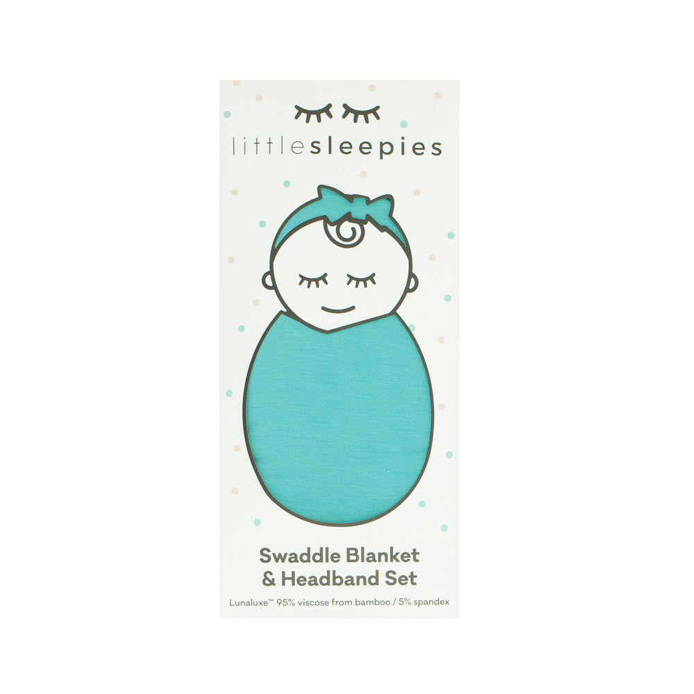  image of a Glacier Turquoise swaddle and luxe bow set in Little Sleepies peek a boo packaging