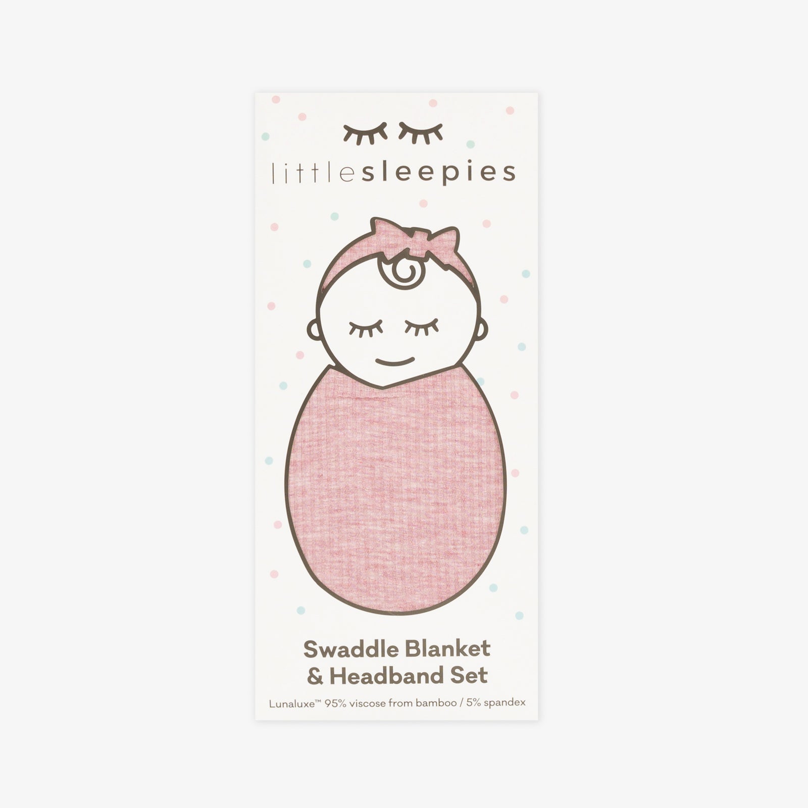 Flat lay image of a Heather Mauve Ribbed Swaddle and luxe bow Headband set in Little Sleepies peek a boo packaging