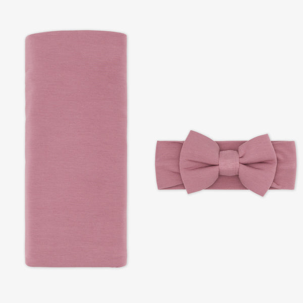 flat lay image of a Cozy dusty plum swaddle and luxe bow headband set