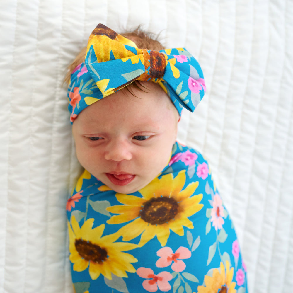 Close up image of the Sunflower Fields Swaddle & Luxe Bow Headband 