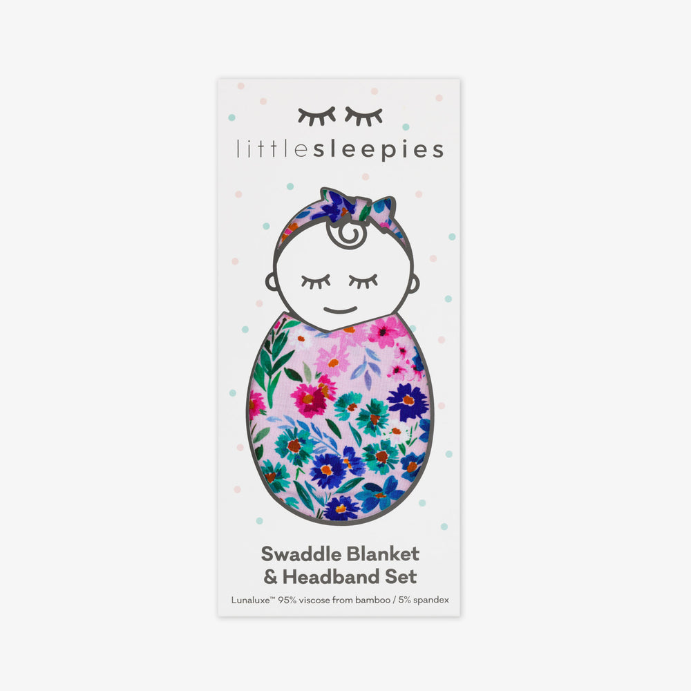 image of a Sweet Pea Floral swaddle and luxe bow headband set in Little Sleepies peek a boo packaging 