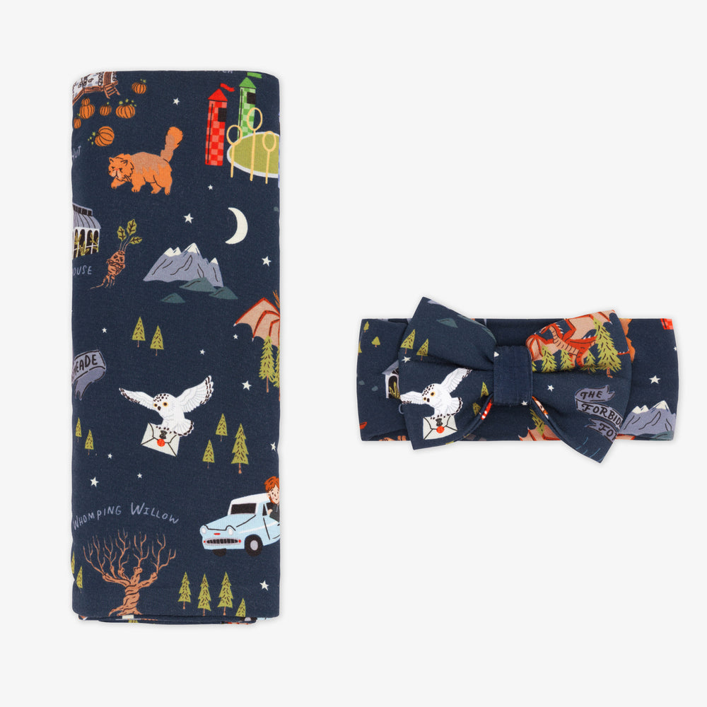 Flat lay image of a an Evening at Hogwarts swaddle and luxe bow headband set