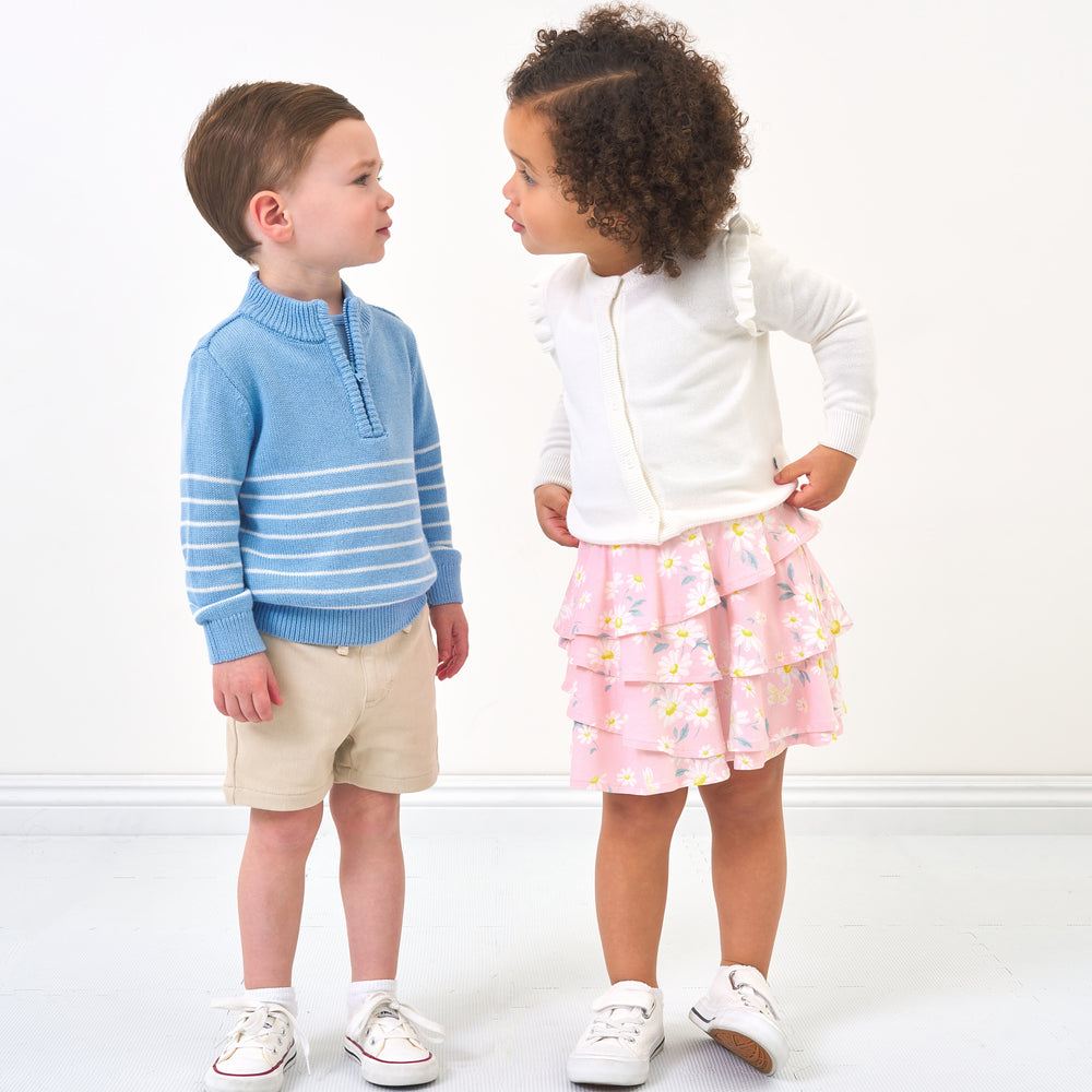 Click to see full screen - kids looking at eachother in spring clothes