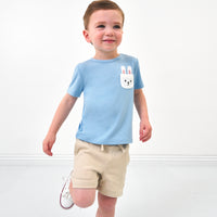 Child wearing a Lake Blue pocket tee and coordinating shorts