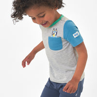 Child wearing a Bluey graphic pocket tee and coordinating joggers