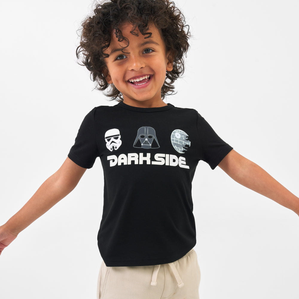 Child wearing a Dark Side graphic tee and coordinating Play bottoms